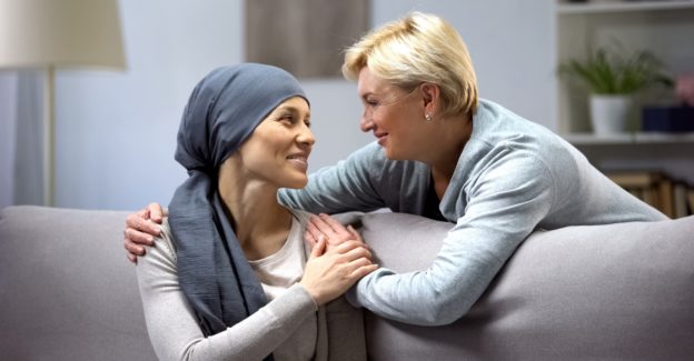 a friend giving support to a cancer patient