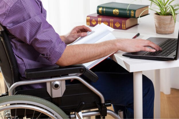 Person in a wheelchair filing a Mutual of Omaha disability claim