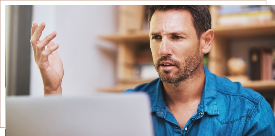 A man looking at a computer screen