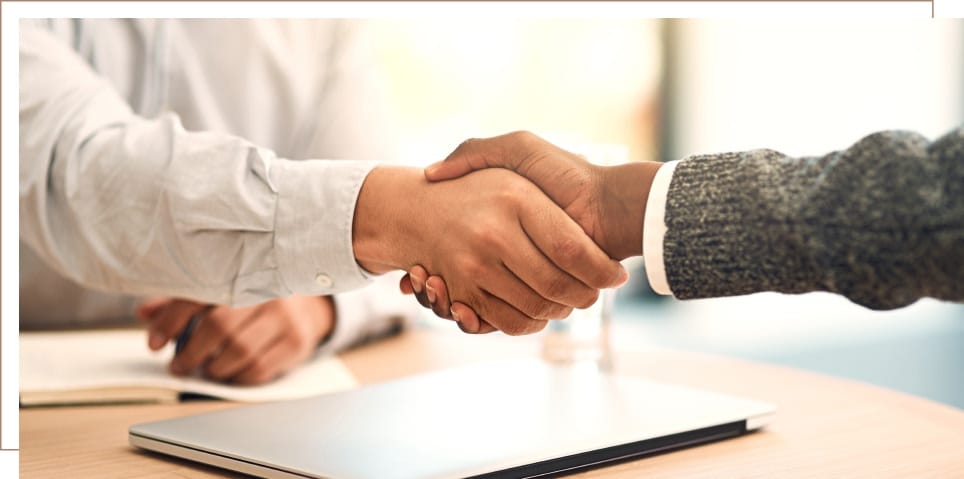 close-up of two people shaking hands