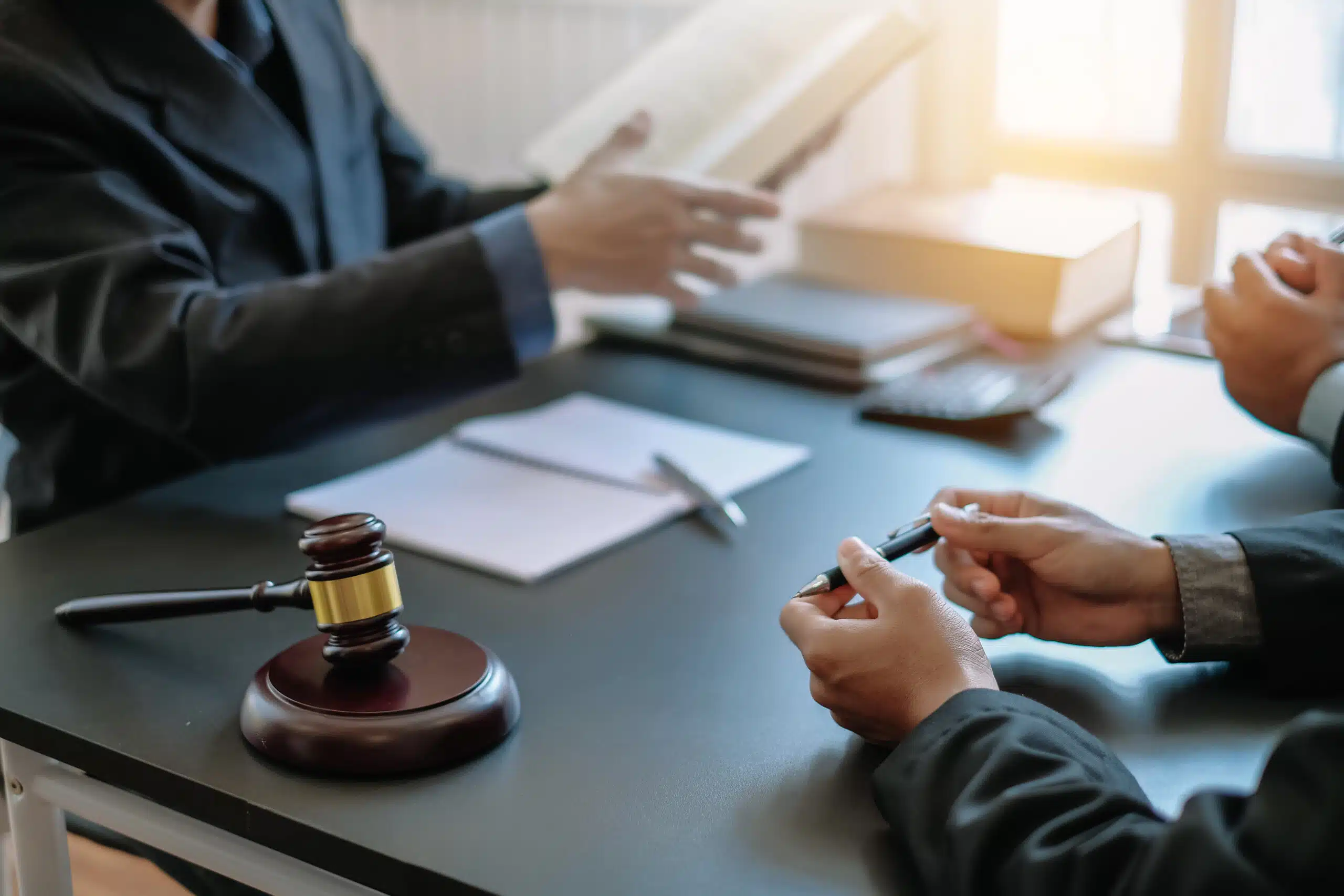 How to Approach Claims for Hidden Disabilities 2 Businessman and lawyer discuss the contract document. Treaty of the law. Sign a contract business.