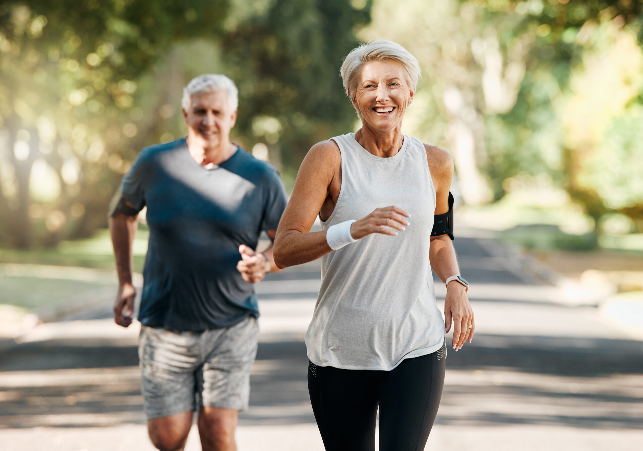 Short-Term Disability Benefits Retirement, couple and running fitness health for body and heart wellness with natural ageing. Married, mature and senior people enjoy nature run together for cardiovascular vitality workout.