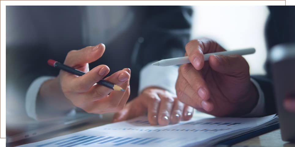 a medical professional and a disability lawyer reviewing paperwork for a disability claim