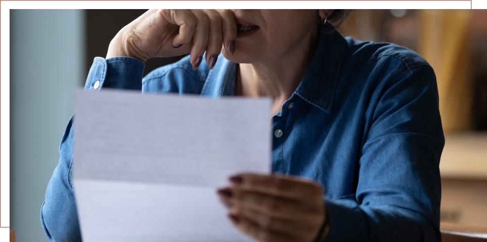 a doctor reading a paper about a disability claim