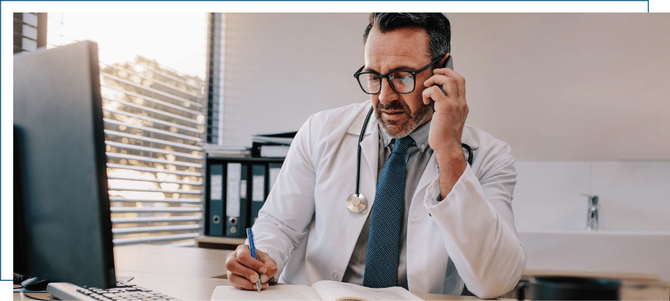 A dental professional making a phone call