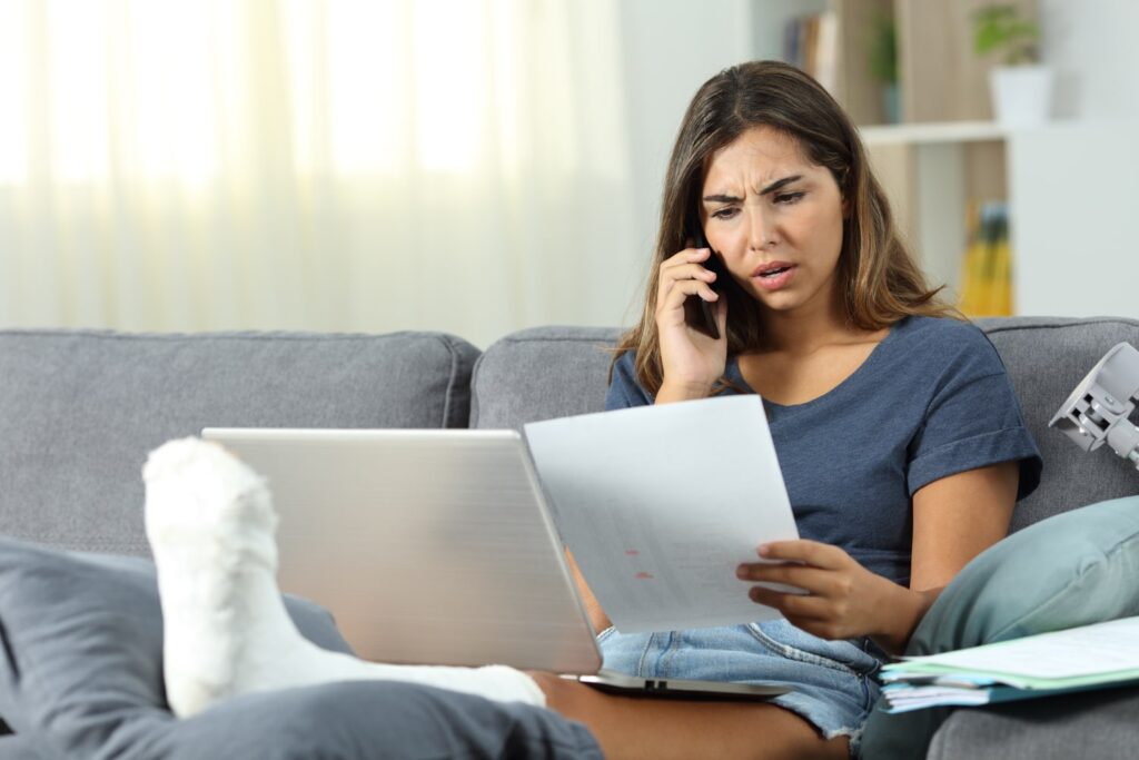Insurance Claim Lawyers at Byrant Legal Group assist woman with legal paperwork