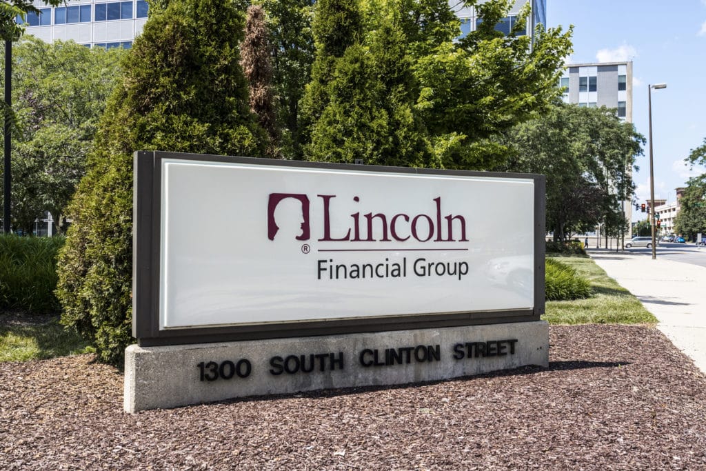 Lincoln Financial Group exterior sign at 1300 South Clinton Street office location surrounded by trees and landscaping