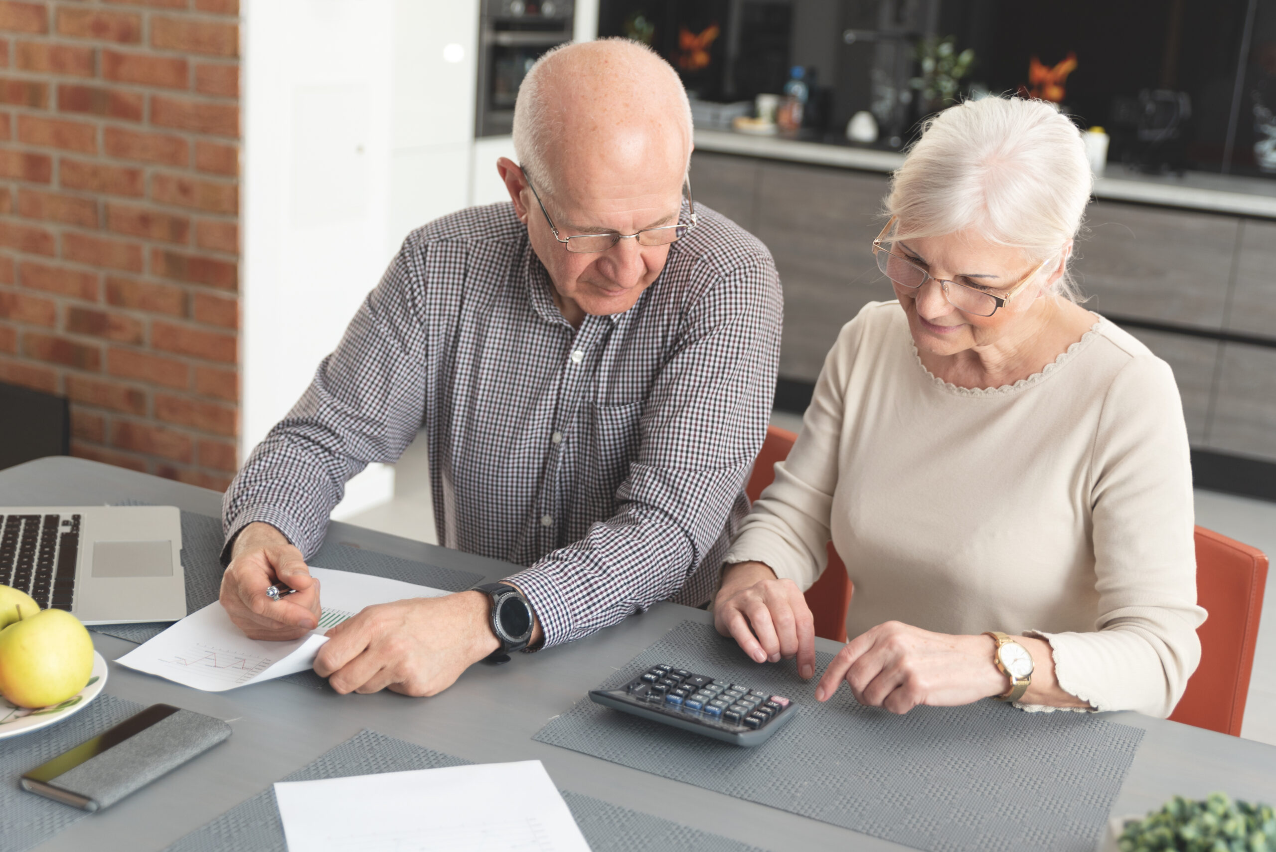 Senior couple checking erisa benefits