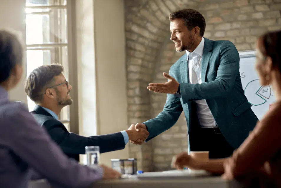 aboutus-history Bryant Legal Group Man shaking hands during meeting