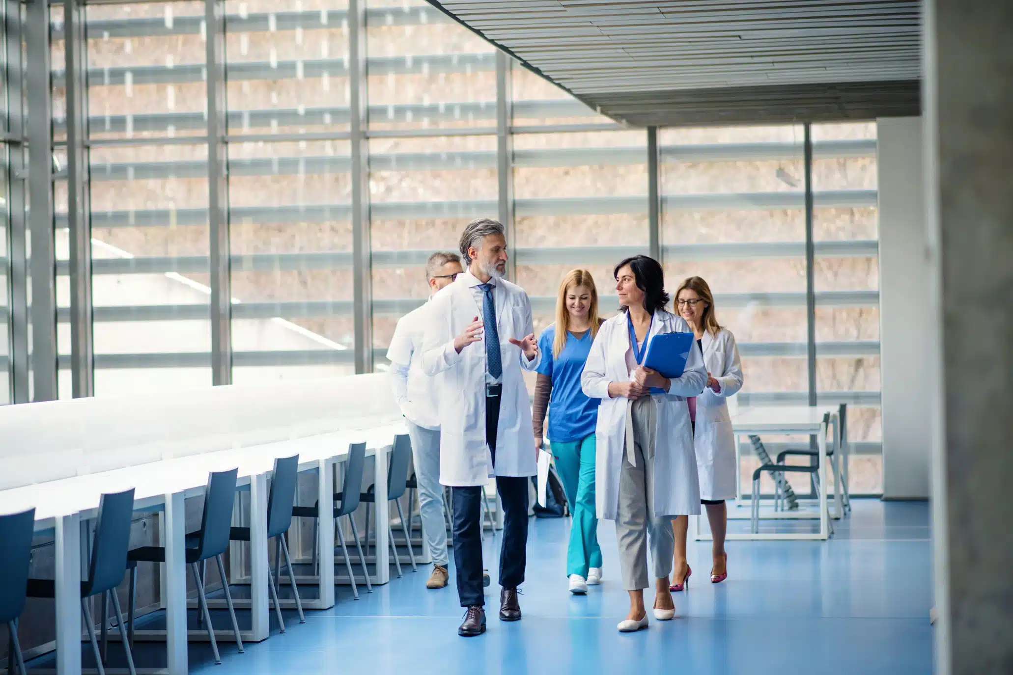 Group of physicians discussing long-term disability insurance and medical practice coverage