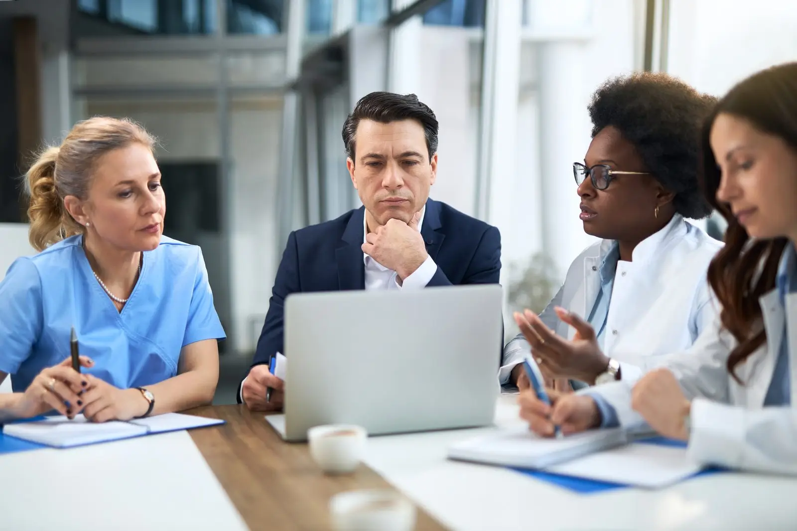 Professionals meeting with medical staff to discuss a long-term disability claim